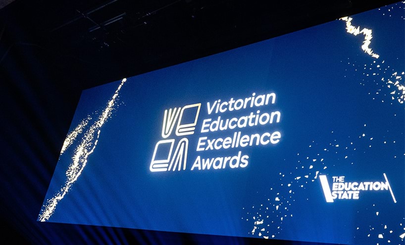 Image of the Victorian Education Excellence Awards logo projected onto a screen.